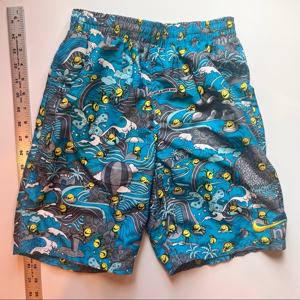 Nike Boys swim short size L blue Nike swoosh smile